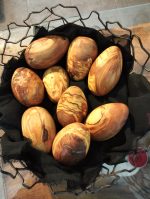 wooden egg nest made from olive wood
