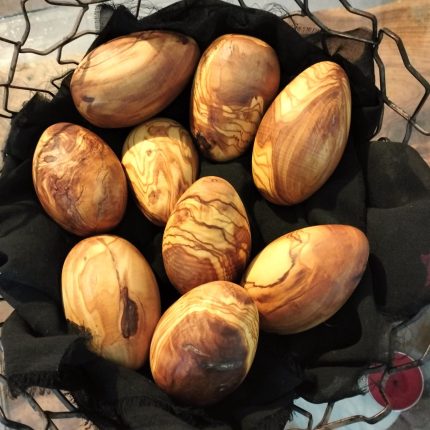 wooden egg nest made from olive wood